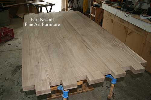 shows tenons at one end of this dining table shows tenons at one end of this dining table